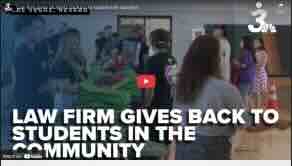 Law firm gives students backpacks loaded with supplies