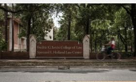 A University of Florida Levin College of Law student who won top honors for a controversial paper is now banned from campus and faces possible expulsion after posting racist and antisemitic statements on social media.