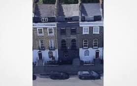 London: Lawyer paints exterior of his Islington House Black.. Nimbys Go Nutty